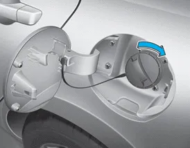 Hyundai Accent fuel tank cap tightened until it clicks and fuel filler door closed securely