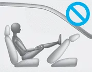 Hyundai Accent OCS warning: do not place feet on the front passenger seatback