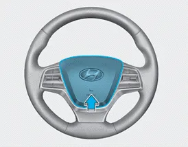 Hyundai Accent steering wheel horn activation area marked with horn symbol